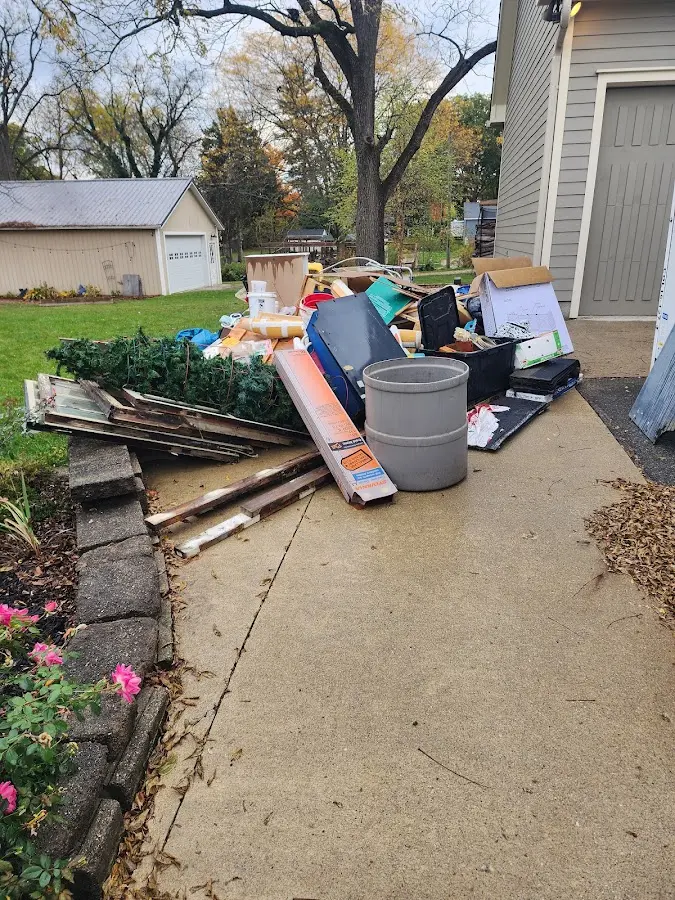 Dumpster being loaded with debris for Estate Cleanout Dumpster Rental in Abington